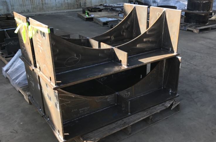 A pipeline shoe sits outside to be shipped with other piping shoes.